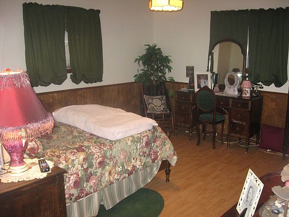 One of the large bedrooms with newer laminate flooring.