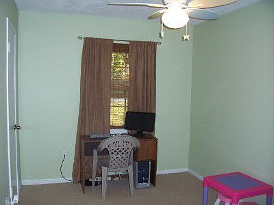 Bedroom with ceiling fan.