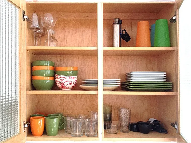 kitchen fully stacked with everything for cooking and serving