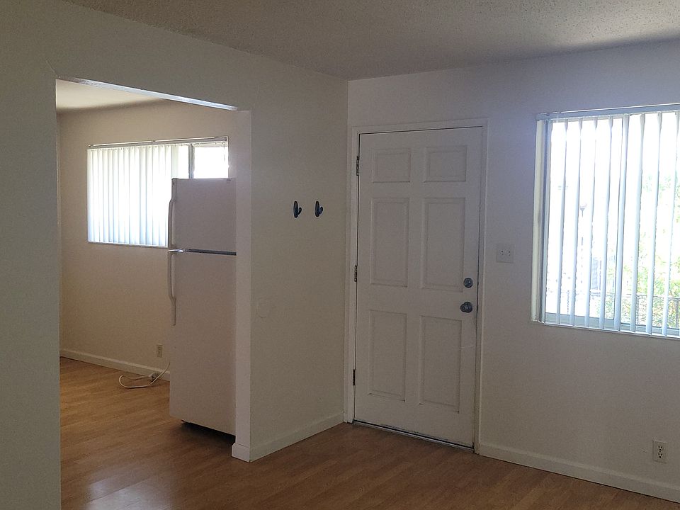Living Room, Window, exterior door, and portion of the kitchen
