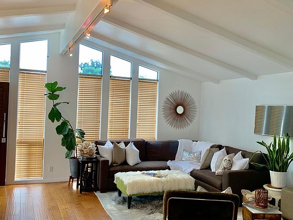 Bright living room w/ custom designer furniture.