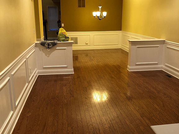 Living Room with wainscoting and crown molding