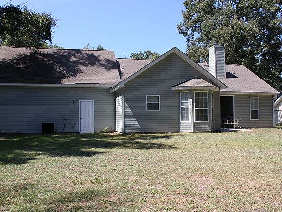 Back of your new home with fenced in yard.