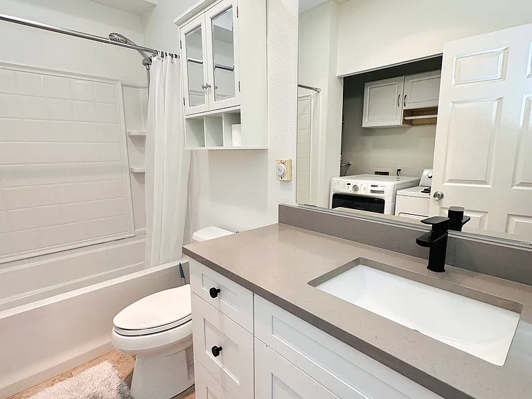 New bathroom countertop, sink, and faucet, vent and light.