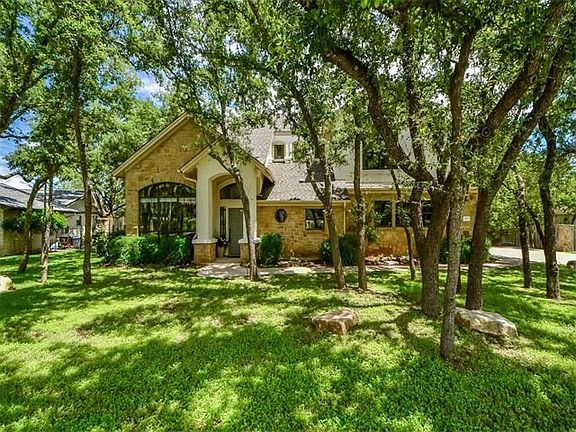 Beautiful curb appeal from the front and peek-a-boo views of Lake Travis from the back!
