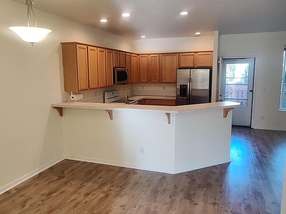 Dining area, kitchen & patio door