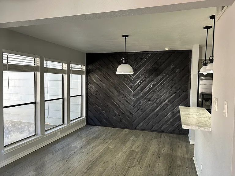 Dining room with 3 large windows that filled the room light. Great views of golf course.