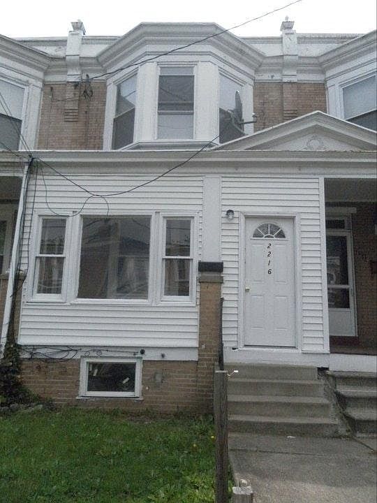 Front of home with enclosed porch