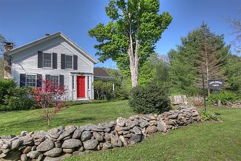 a welcoming traditional red front door