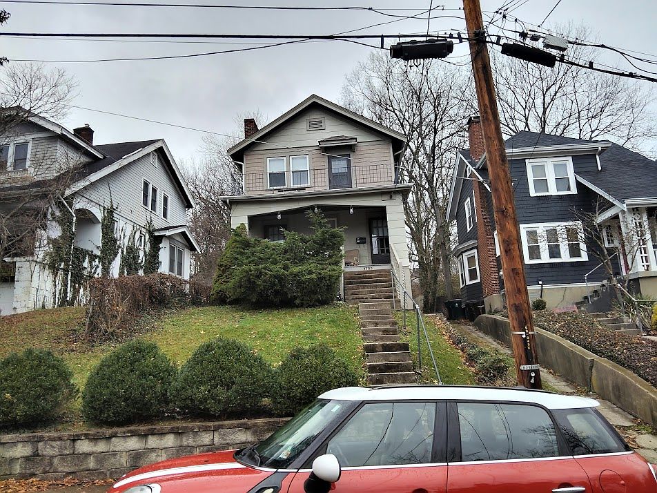 Upstairs apartment with off the street parking behind the house, narrow and steep driveway