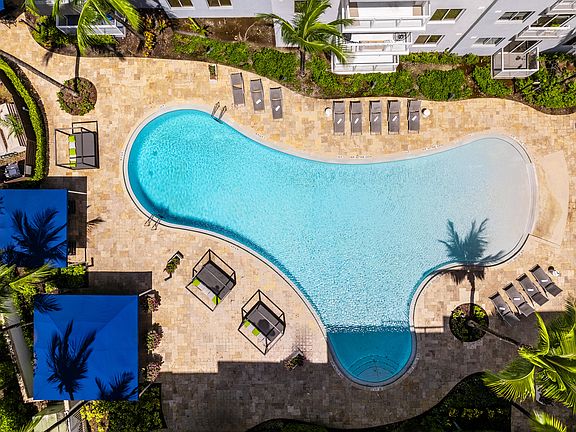 Free-Form Swimming Pool With Lounge Areas