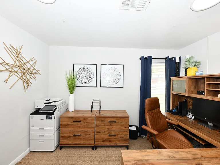Explore this stylish home office, offering functionality and elegance in one space.