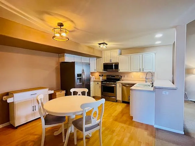 Kitchen and Dining area with stainless steel appliances