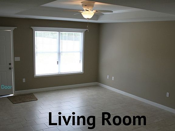 Large living room with easy to maintain tile floors.