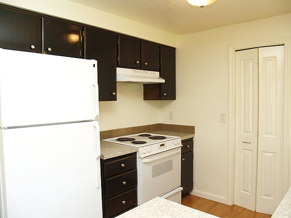 Kitchen enjoys plenty of cabinetry plus pantry