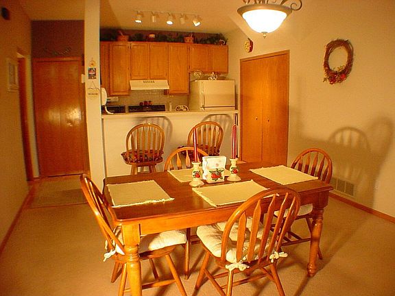 Dining, kitchen view.  Enjoy a breakfast bar, extra tall cabinets & a pantry!