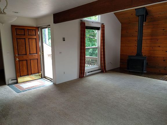 Tile entry, wood burning stove.