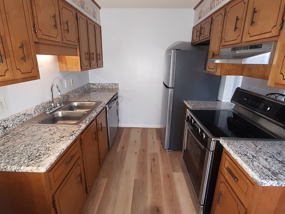 Chef's kitchen with new granite countertops, new refrigerator and dish machine, convection oven and new LVP flooring.