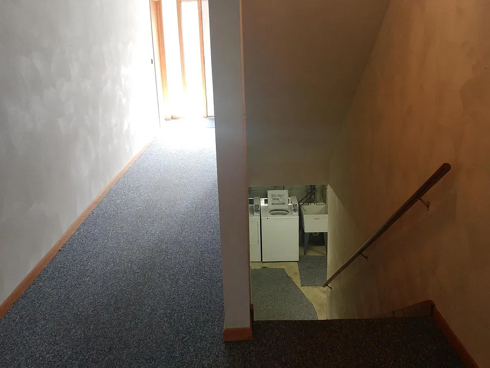 Stairway to apartment & Laundry