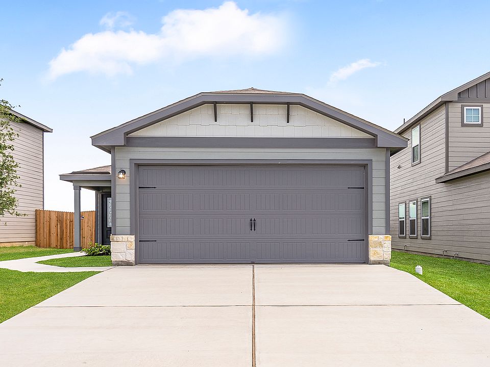 The exterior Chestnut by LGI Homes with stone detail