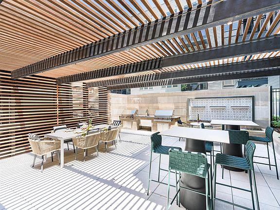 Gather under the slatted shade for casual cookouts or weekend brunches_perfect for connecting with neighbors or entertaining friends in style.