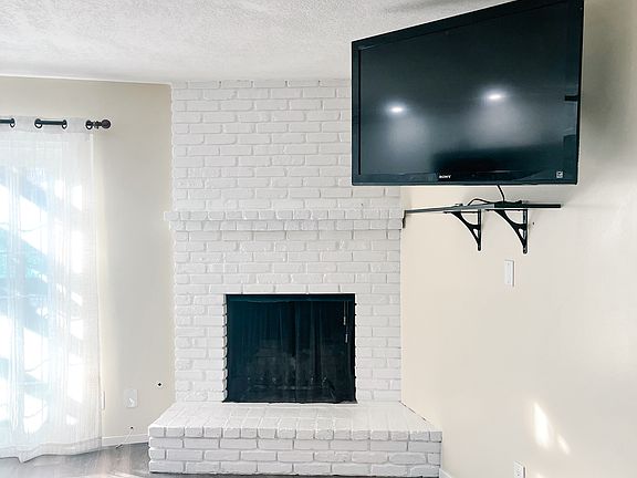 Studio has a fireplace and a large TV