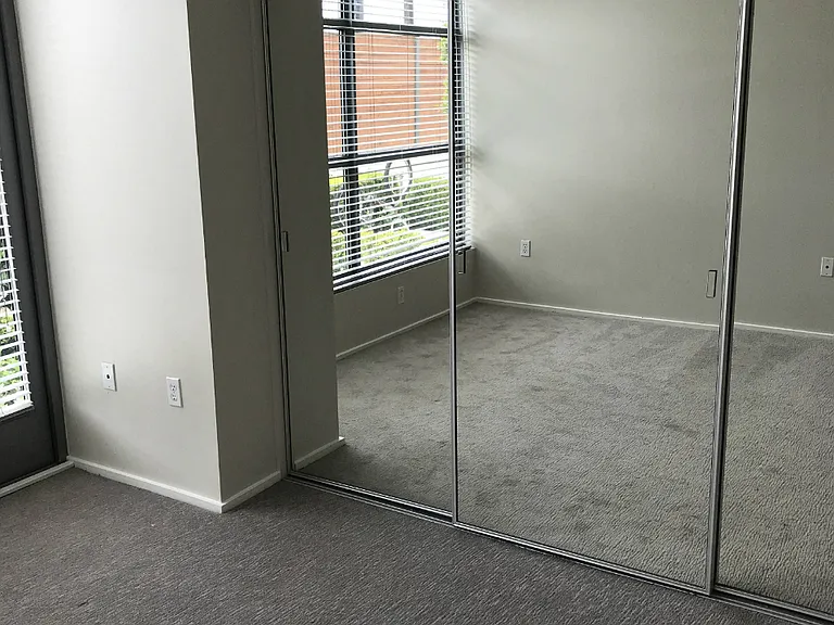 Master bedroom of Allure floorplan with mirrored glass closet