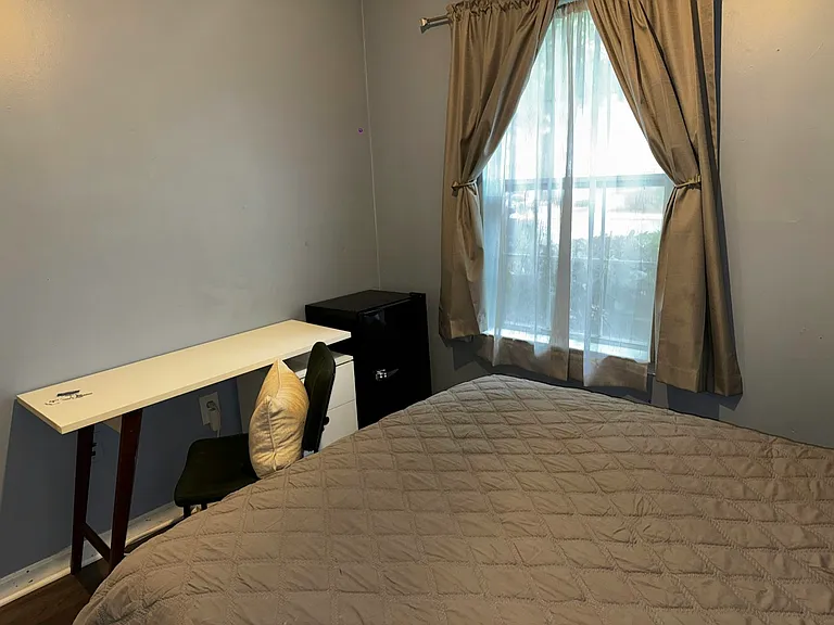 Desk with chair and mini top freezer refrigerator