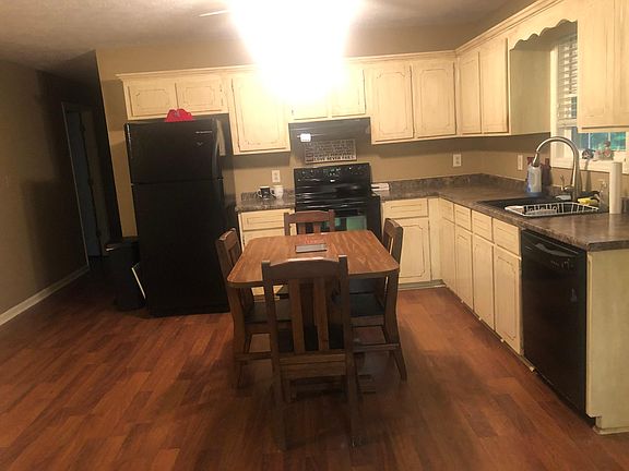 refrigerator and kitchen table included