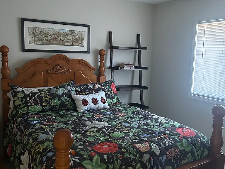 Private 2nd bedroom with walk in closet and bathtub and tiled shower with handrails