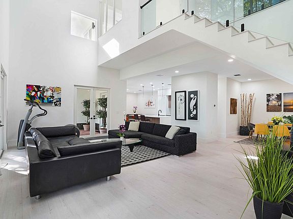 Living room with high ceiling and lots of natural light