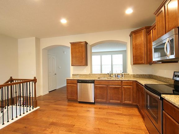 The kitchen is spacious and graced with upscale finishes inc