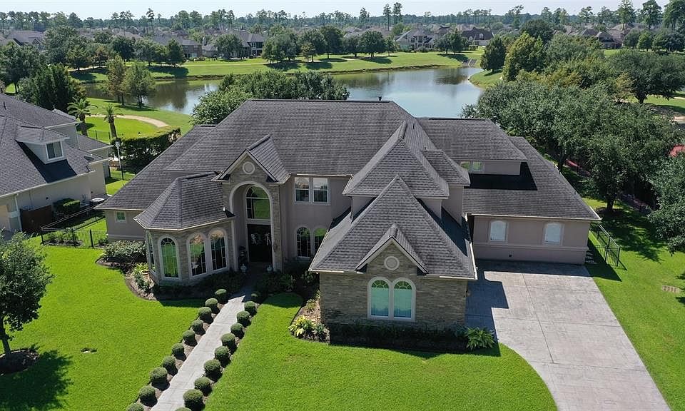 Custom home sits on an oversized lot backing to the lake