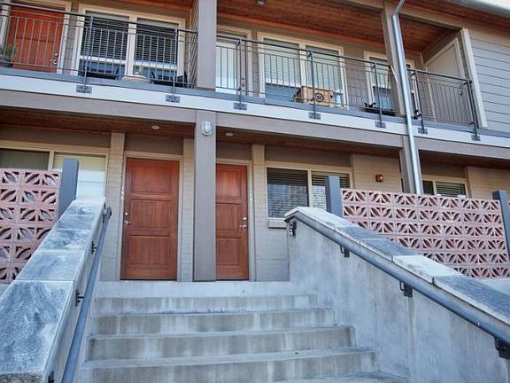 First floor open floor plan. Large windows in front and back of condo unit.