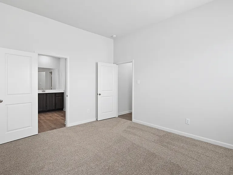 The master suite has a large bedroom, ensuite bathroom and a walk-in closet.