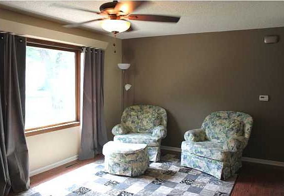 LIVING ROOM FEATURES A LARGE PICTURE WINDOW FOR NATURAL LIGHT