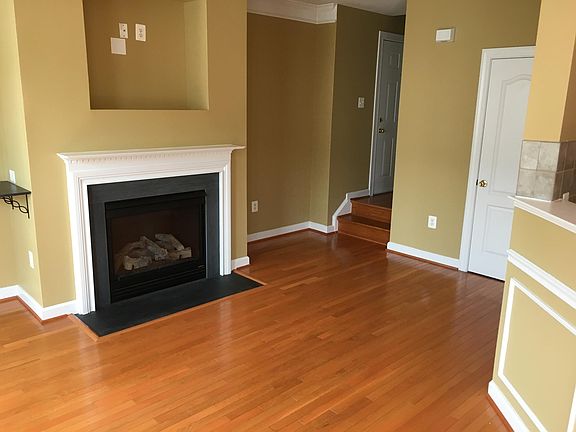 Living room with Hardwood Floor & Fire Place