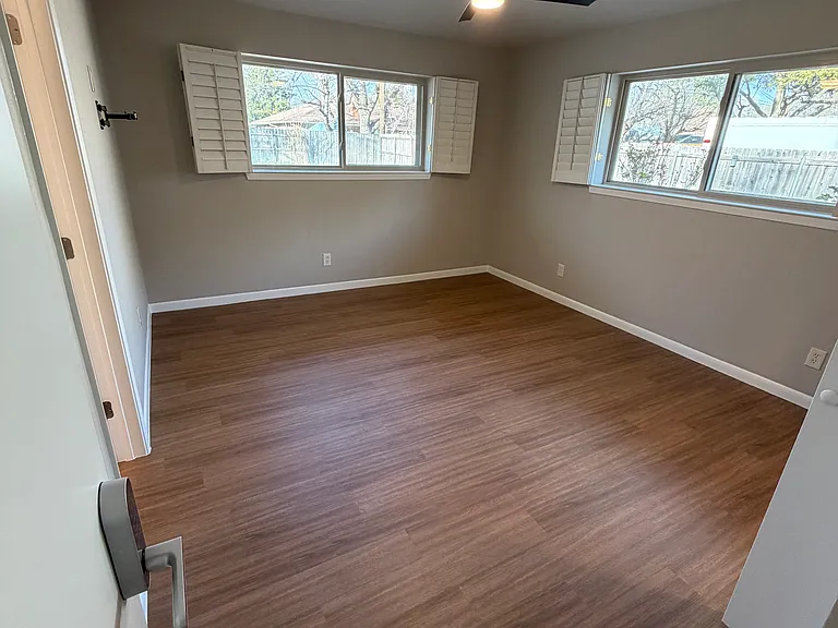 Alpine 12x16 and has plantation shutters, and overlooks the back yard.