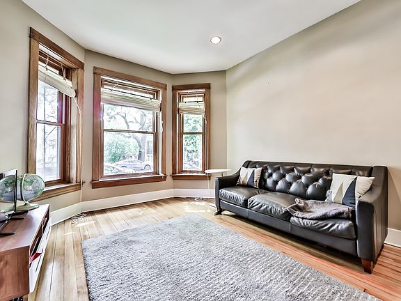 View of the living room looking toward the bay overlooking the street