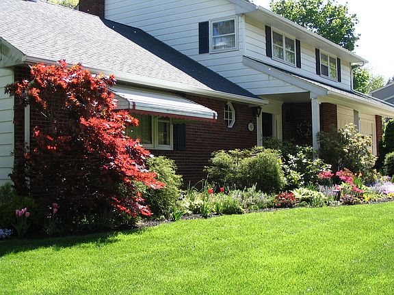 Beautiful gardens surround the home