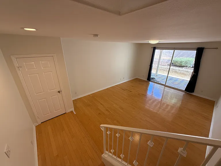 stairs down to another large family room
