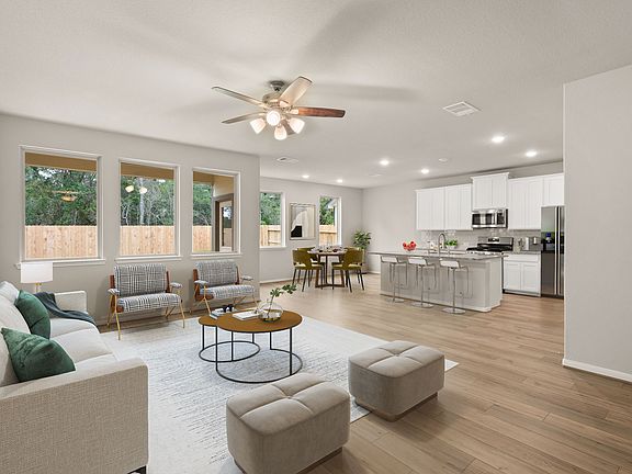 Gather the family and guests together in your living room open to your kitchen.