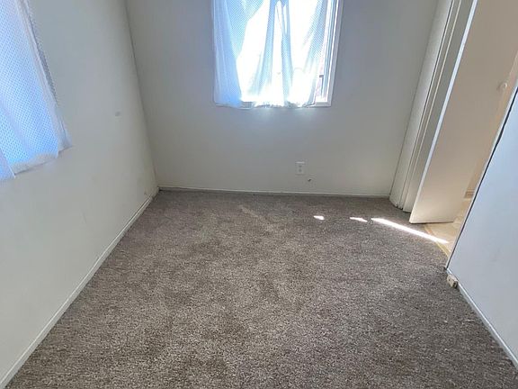 bedroom next to kitchen