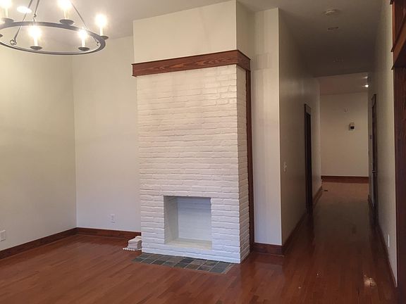 Living space #1--fresh paint and new chandelier