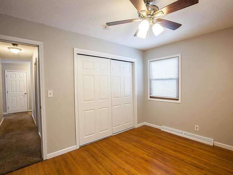Bedroom 1 on main level with wood floor
