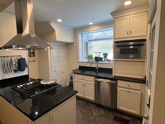 kitchen: 6 burner gas stove, subzero, granite countertops, custom cabinets