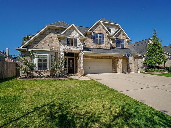 This well-maintained 2-story property features a manicured lawn that gives way to a spacious driveway and attached, 3 car garage.