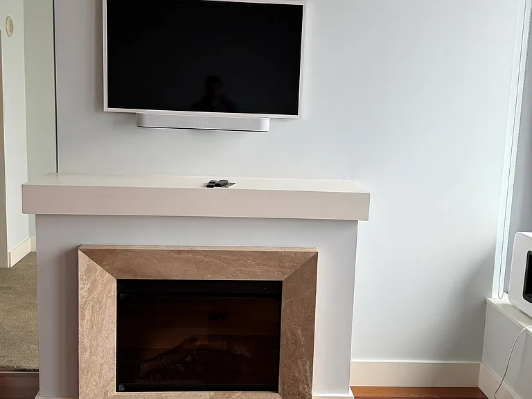 electric fireplace and Samsung Frame TV with Sonos Surround Sound