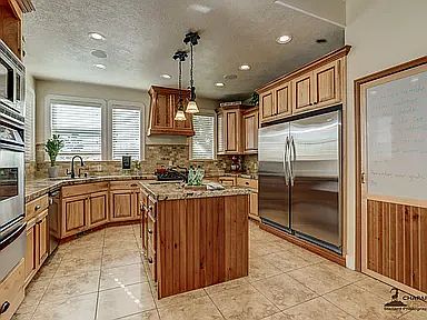 Pantry goes all the way behind the refrigerator/freezer.