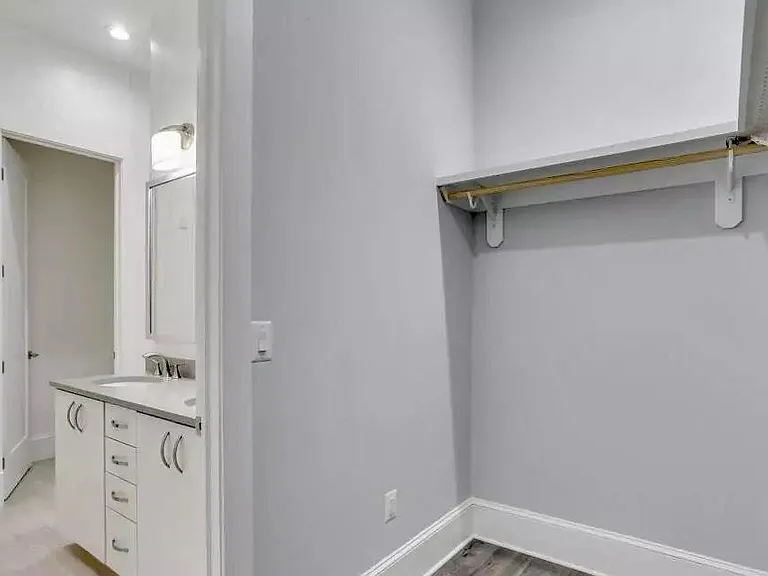 partial view of master closet and bath